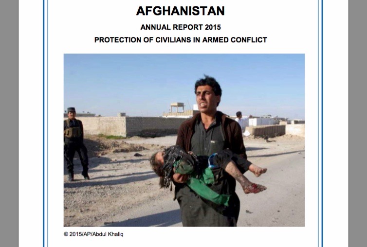 A man carries a girl injured in a suicide attack at a checkpoint in Lashkargah, Helmand , killing two civilians and injuring two others,16 March 2015. Front Page of UNAMA report © 2015/AP/Abdul Khaliq.