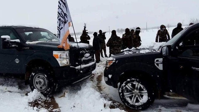 Photo posted recently by Taleban social media activists showing, they said, fighters in Kunduz. Vehicle carries the movement’s flag and fighters appear all to be in camouflage, while one wears a headband. (2016)