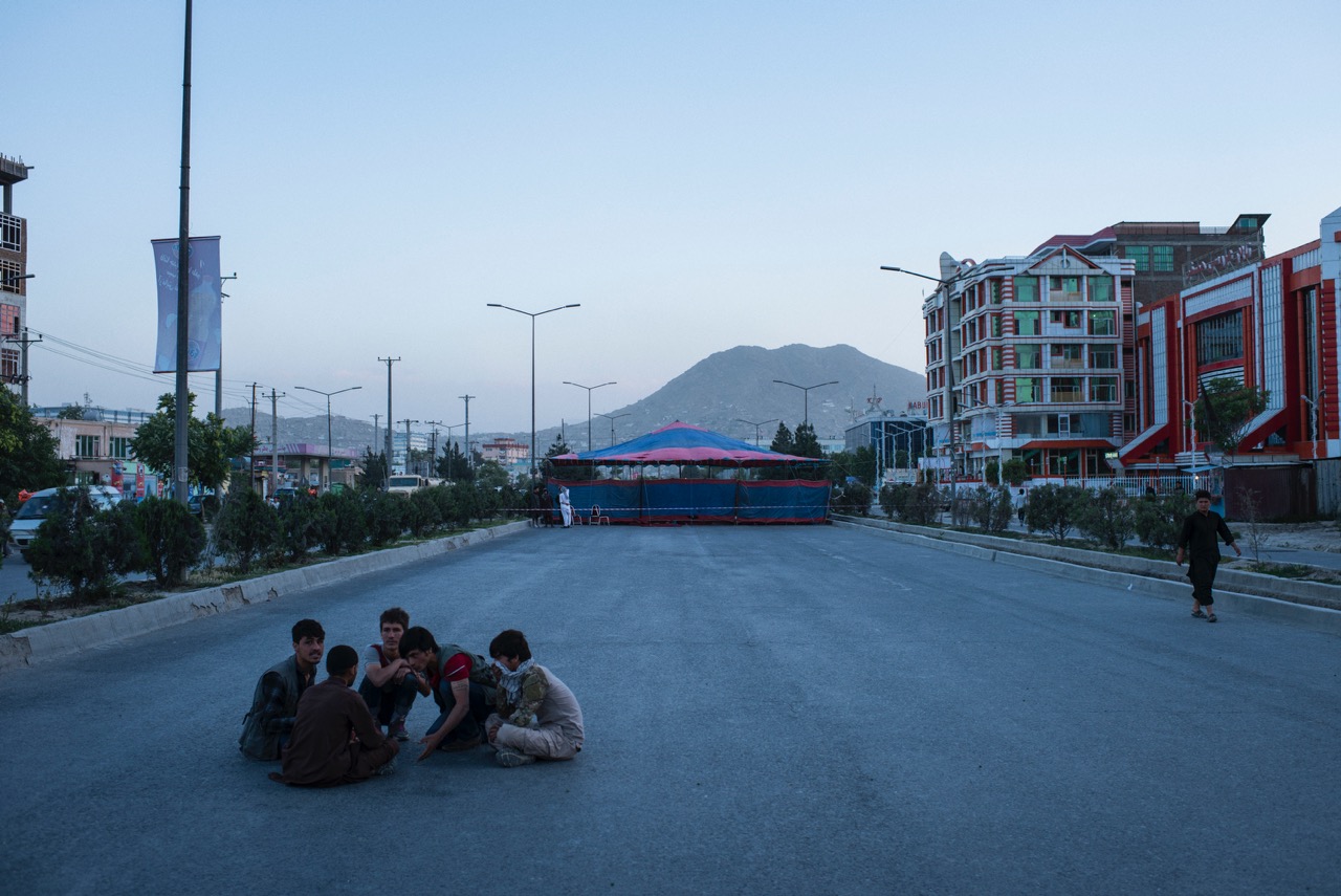 10 June 2017, outside one of several protest tents -- this one on 40 Metre Road near the Taimani Project -- that were erected on main roads around Kabul in response to both a truck bombing near the German Embassy that killed 150 and wounded as many as 500 as well as the police response to demonstrations that followed in which several protestors were killed. The last tent was removed three weeks after it was erected. Credit: Andrew Quilty for AAN
