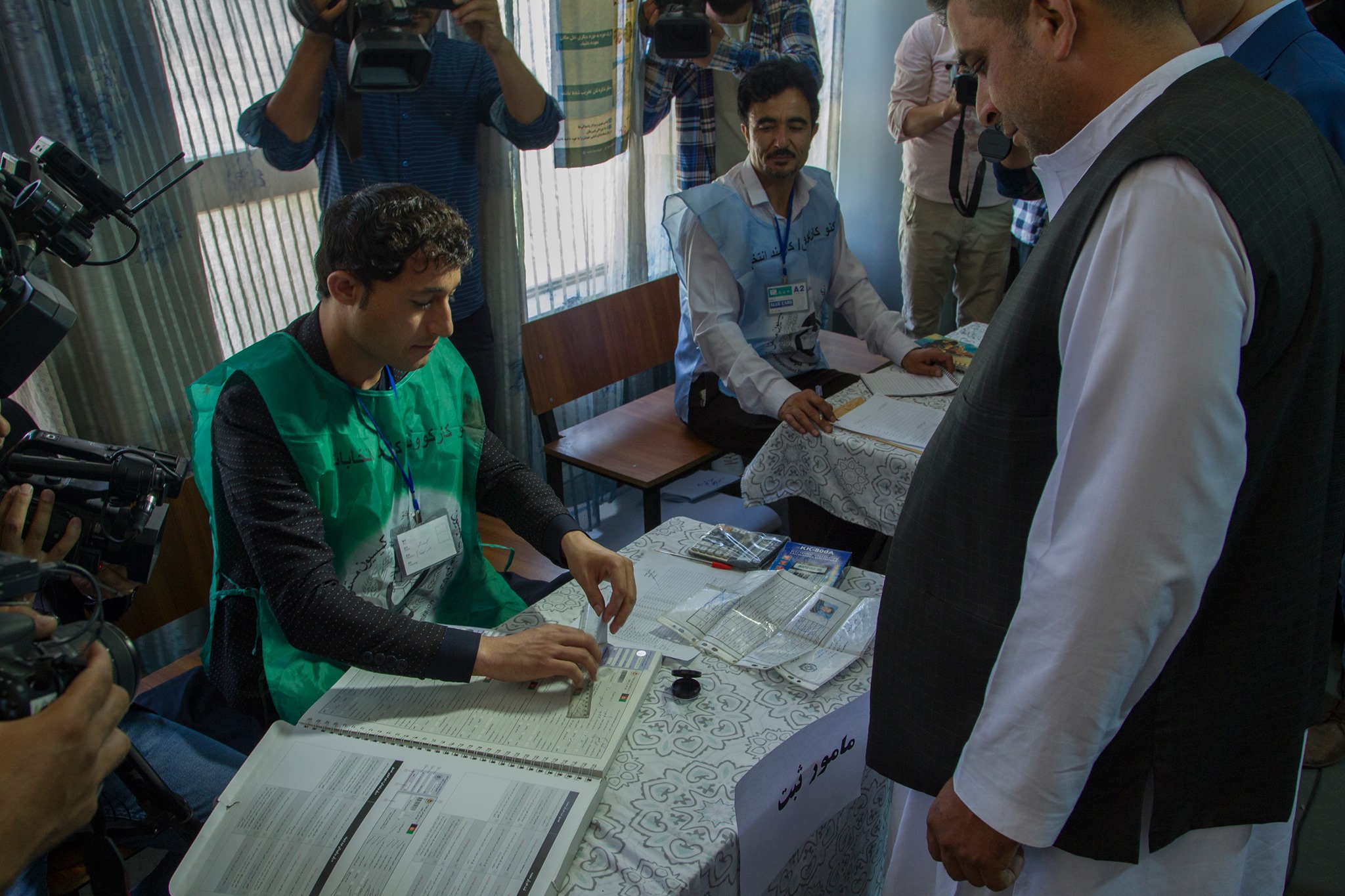 An IEC registration officer registers a voter at Naderia High School in Kabul as the IEC launched a 22-day top up voter registration across the country on 8 June 2019. Photo: IEC Facebook page