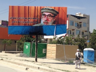 Posters celebrating the return of Gulbuddin Hetkmatyar have been put up in Kabul. Within hours, they were defaced. “I have always wanted my country free and independent,” this one says. "I think of nothing else.” (Photo: Ehsan Qaane)