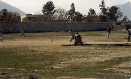 Afghans playing cricket in Kabul, 1999, in a field in Wazir Akbar Khan, near the roundabout in front of the current British embassy. The field was also used by Kuchis for grazing their animals and by beekeepers. It is now built on. (photo: Stuart Bentham)